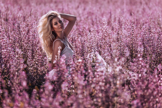 Beautiful woman in pink field