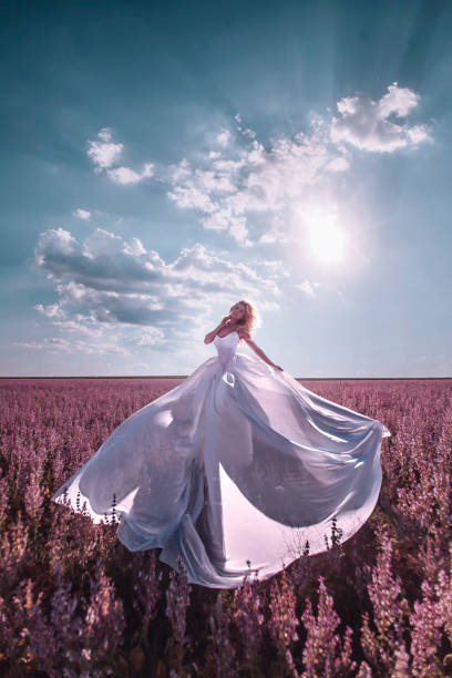 istock Beautiful woman in pink field 1262606084