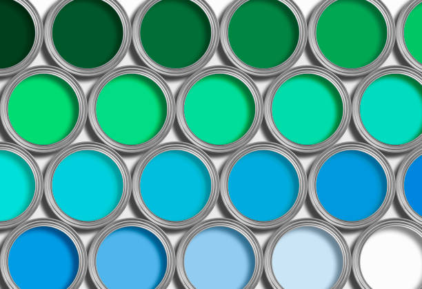 istock Rows of blue and green open paint tins on white 126260710