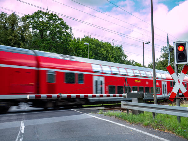 istock train in motion at the level crossing 1262610193