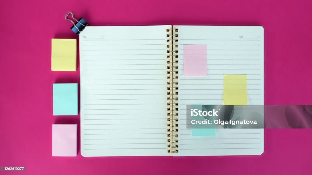 Open blank journal on pink background. Concept for creative person planning. Back to school. Top view, flat lay, mockup Open blank journal on pink background. Concept for creative person planning. Back to school. Top view, flat lay, mockup. Bullet Journal Stock Photo