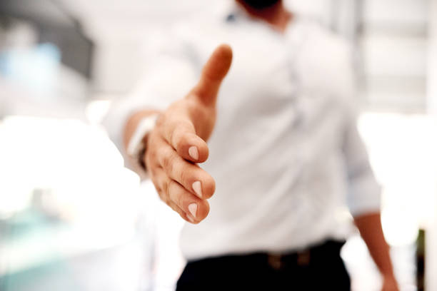 Closeup shot of an unrecognisable businessman extending a handshake
