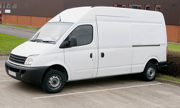 istock White van for branding parked in parking lot 126261087