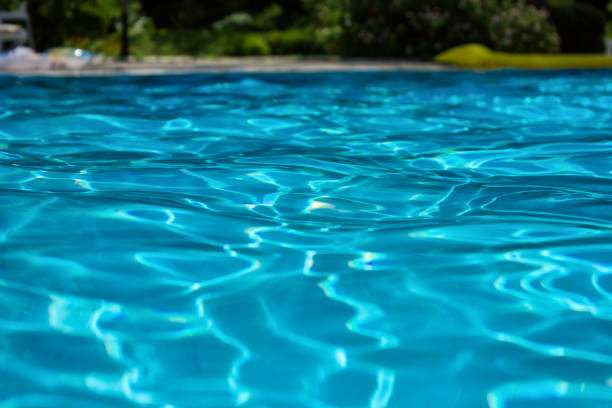 istock Beautiful swimming pool in hotel pool resort. 1262612439