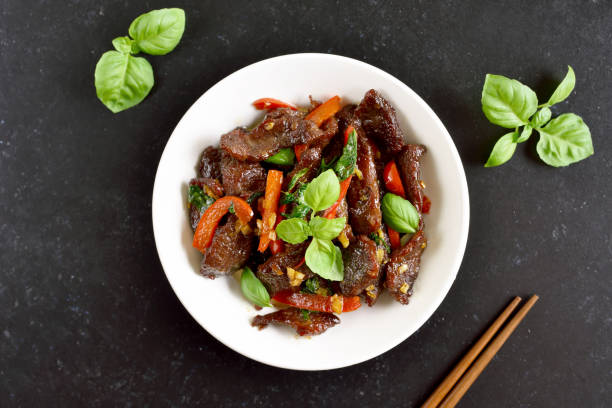 istock Thai style stir-fry beef with vegetables in bowl 1262615077