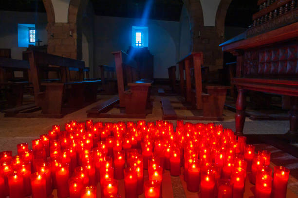 istock Candles lit inside a church 1262616161