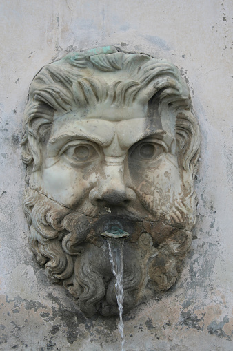 Water fountain coming out of a mans mouth