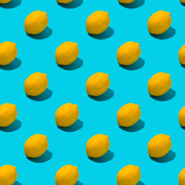 istock Whole lemon with shadow seamless parer on blue background. 1262618533