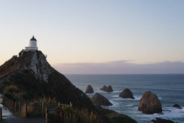 istock Sunrise at Nugget Point Lighthouse 1262619023