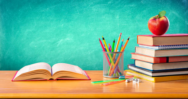 istock Apple On Stack Books With Supplies - Back To School 1262619578