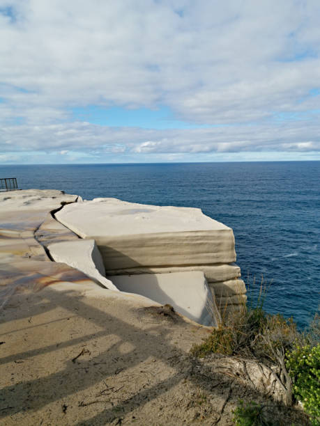 istock Beautiful coalstal trail with stunning rock formations and cliffs along the ocean front in the national park 1262619621