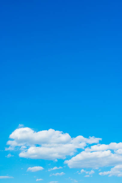 istock beautiful white clouds in the sky, vertical gradient from blue to blue 1262621027