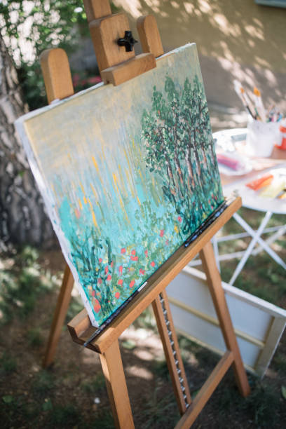 istock Watercolor drawing on canvas stand placed in garden 1262621122
