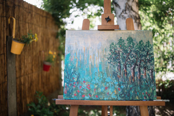istock Painting on canvas placed on stand in garden 1262621191