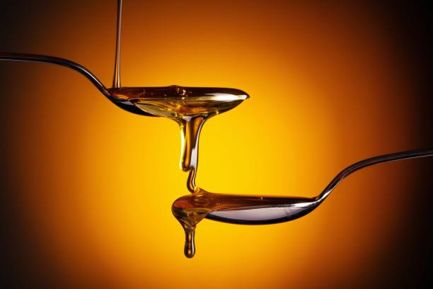 istock Organic honey flowing from the spoon 1262621381