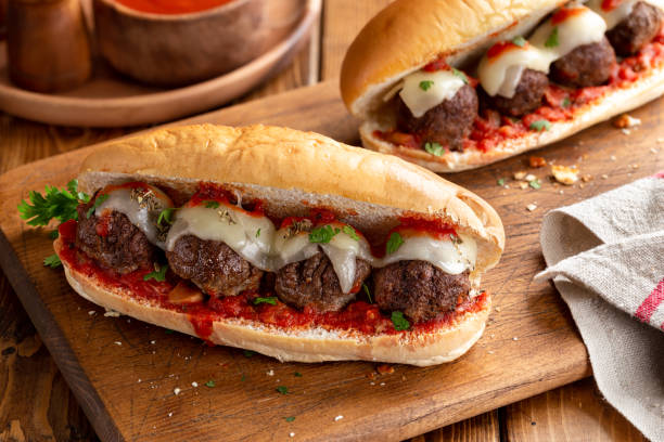 Meatball Sandwich on Hoagie Roll Meatball sandwich with tomato sauce and cheese on a hoagie roll submarine sandwich photos stock pictures, royalty-free photos & images