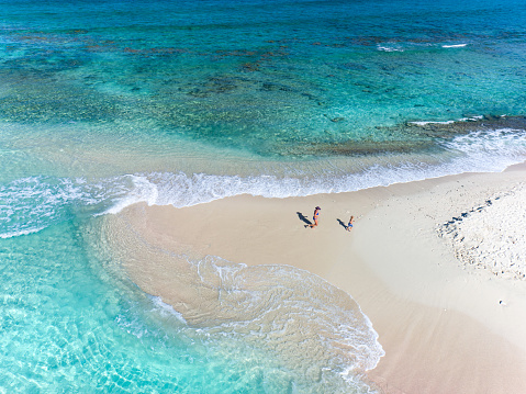 Aerial view of mother and child on Sandy Spit, British Virgin Islands, Caribbean