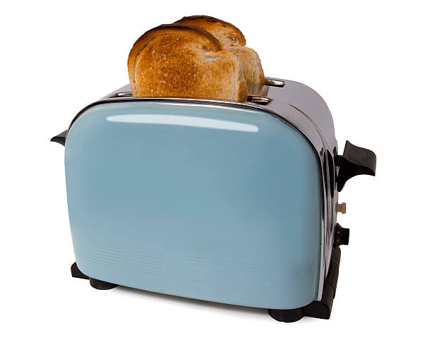 Old retro toaster with toast in on white with path stock photo