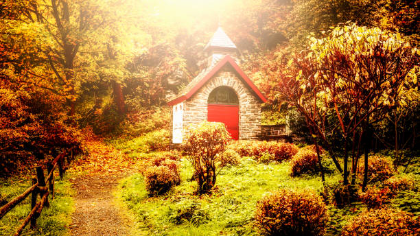 Little church in fall colors. Autumn forest landscape in Germany