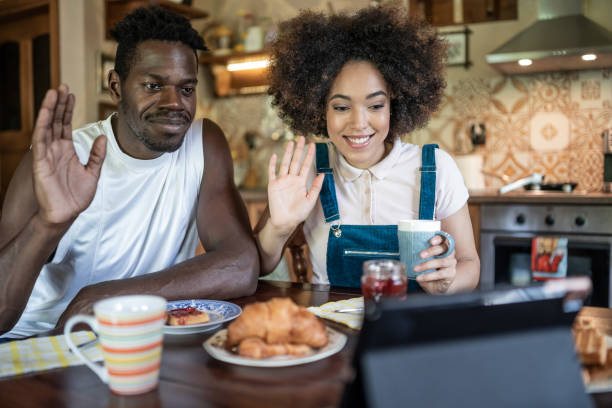 istock Couple enjoying their breakfast and making video conference in home isolation because of pandemic of COVID-19 1262631263