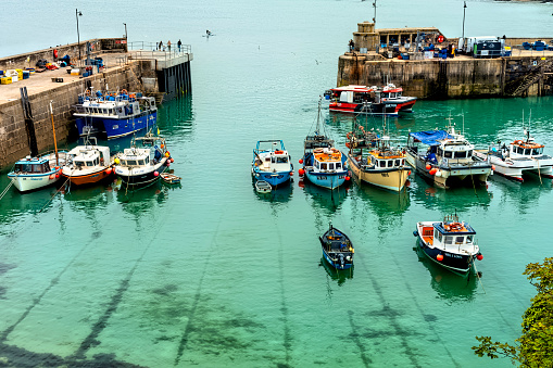 The harbour with fishing boats moored after a days fishing in Newquay, Cornwall, England, UK.