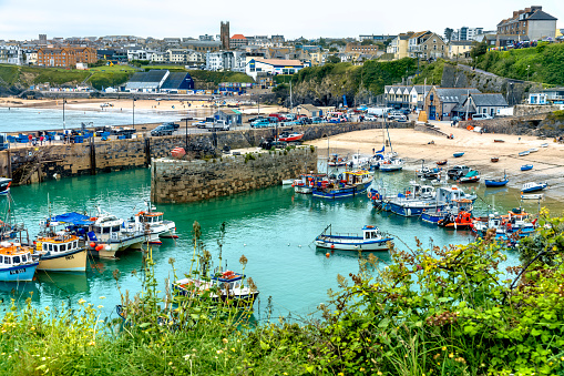 The harbour with fishing boats moored after a days fishing in Newquay, Cornwall, England, UK.