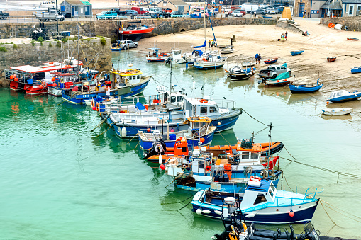 The harbour with fishing boats moored after a days fishing in Newquay, Cornwall, England, UK.