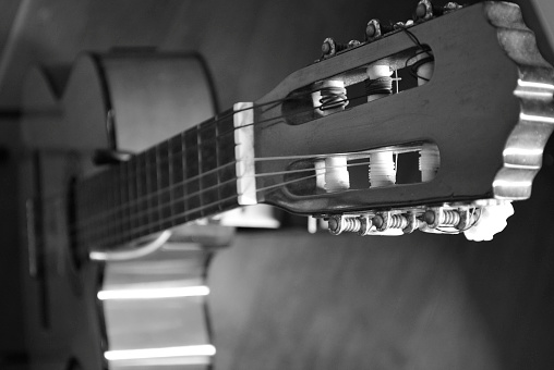 Closeup details of an acoustic guitar, using selective focus