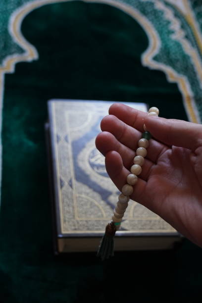 istock Tespih in hand, a Kuran in the background 1262634721