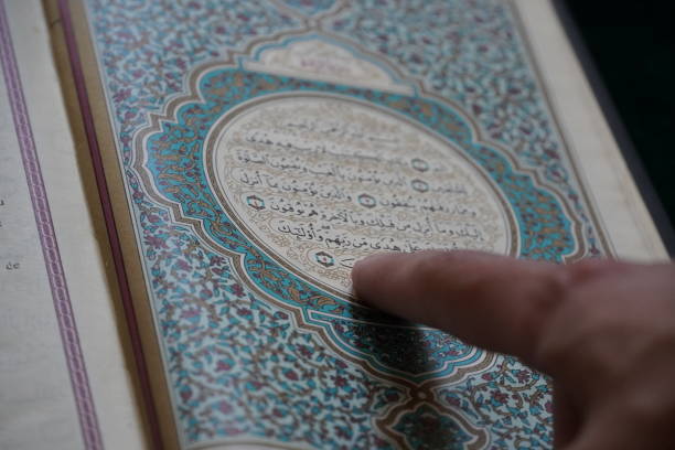 istock Open Quran on a praying carpet 1262634978