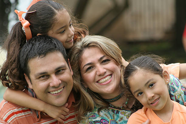 istock Smiling family plays with two daughters  126264785