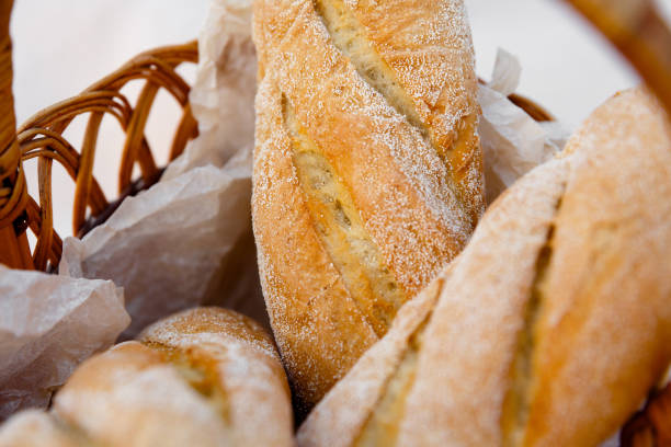 istock three fresh baguettes lie in a wicker basket 1262648379