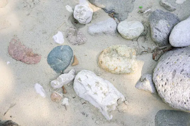 Various stones in the sand