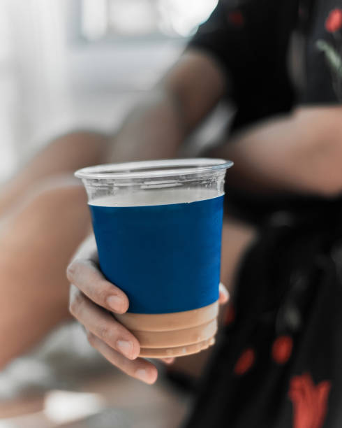 istock Woman holding iced coffee. 1262649043