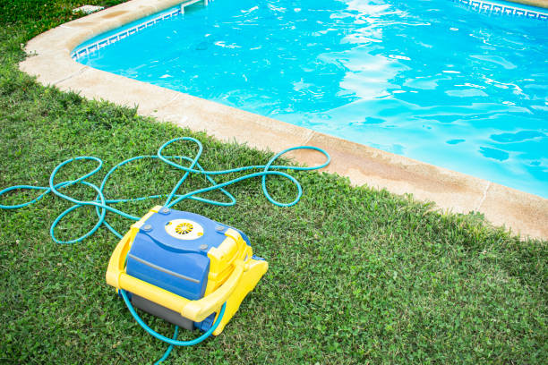 Automatic pool cleaner on grass with suction rubber and water filtration