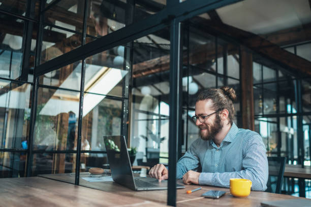 istock Young businessman working at office 1262654294