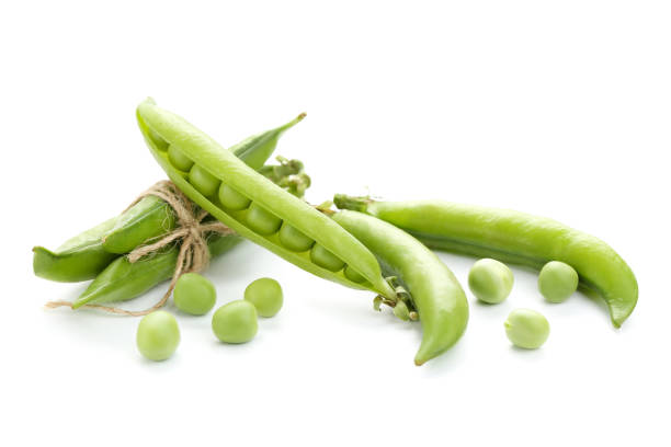 istock Green pea pods isolated on white background 1262655997