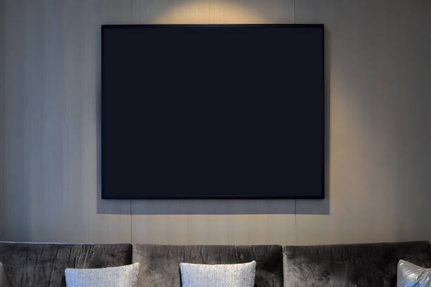 istock Black frame over grey sofa in living room 1262657035