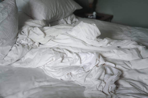 istock Messy bed and pillow. Concept of bed after use for sleep 1262658138