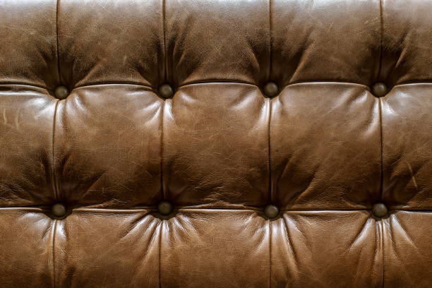 istock brown leather texture of sofa closeup shot 1262658147