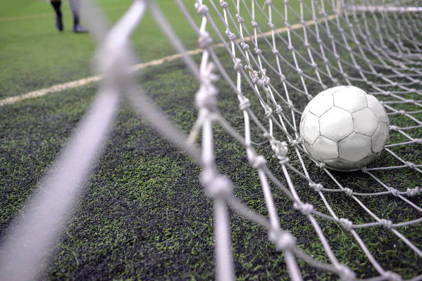 istock Still football behind the goalkeeper net 1262658163