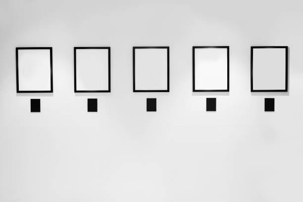 istock 5 Blank white paper canvas photo frame on the white wall for a bulletin 1262658700
