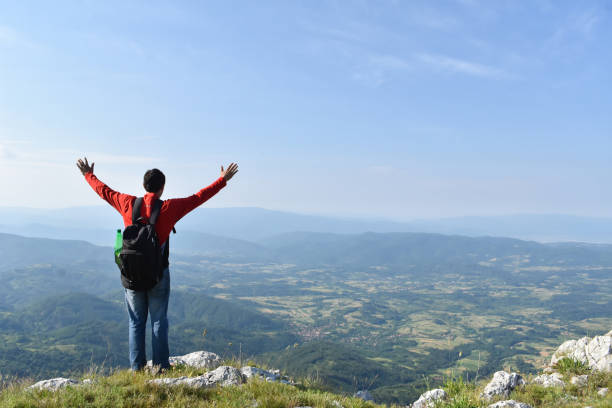 istock Man hiking in the mountains on a summer day 1262660418