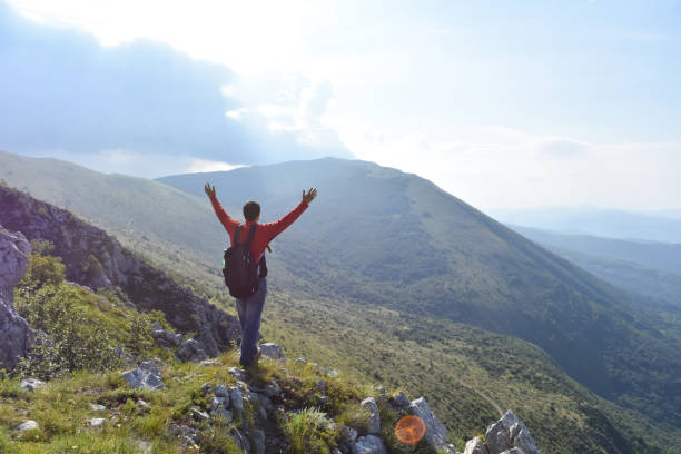 istock Man hiking in the mountains on a summer day 1262661544