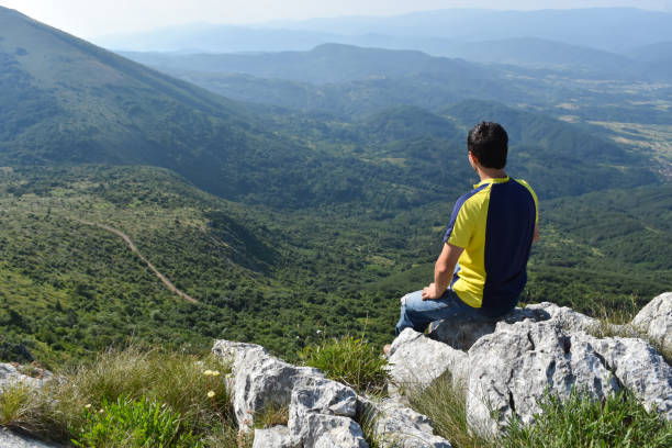 istock Man hiking in the mountains on a summer day 1262662094