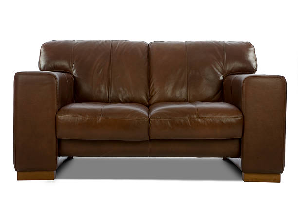 Brown leather sofa isolated on a white background stock photo