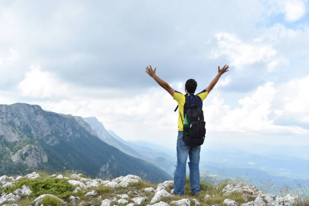istock Man hiking in the mountains on a summer day 1262663779