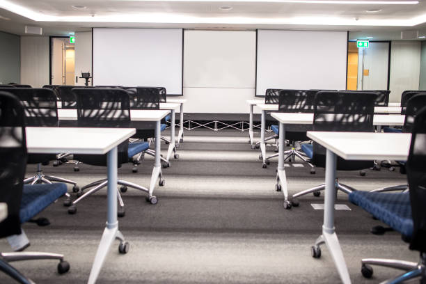 istock 2 Blank screen for slide projector show  in meeting room 1262663832