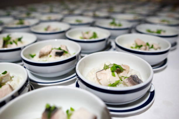 istock Row of Bowl boiled rice with fish fillet 1262663900