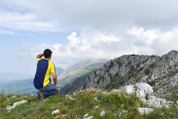 istock Man hiking in the mountains on a summer day 1262663947